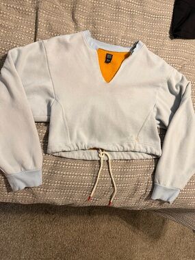 BDG Light Blue Cropped Sweatshirt with Orange Neckline